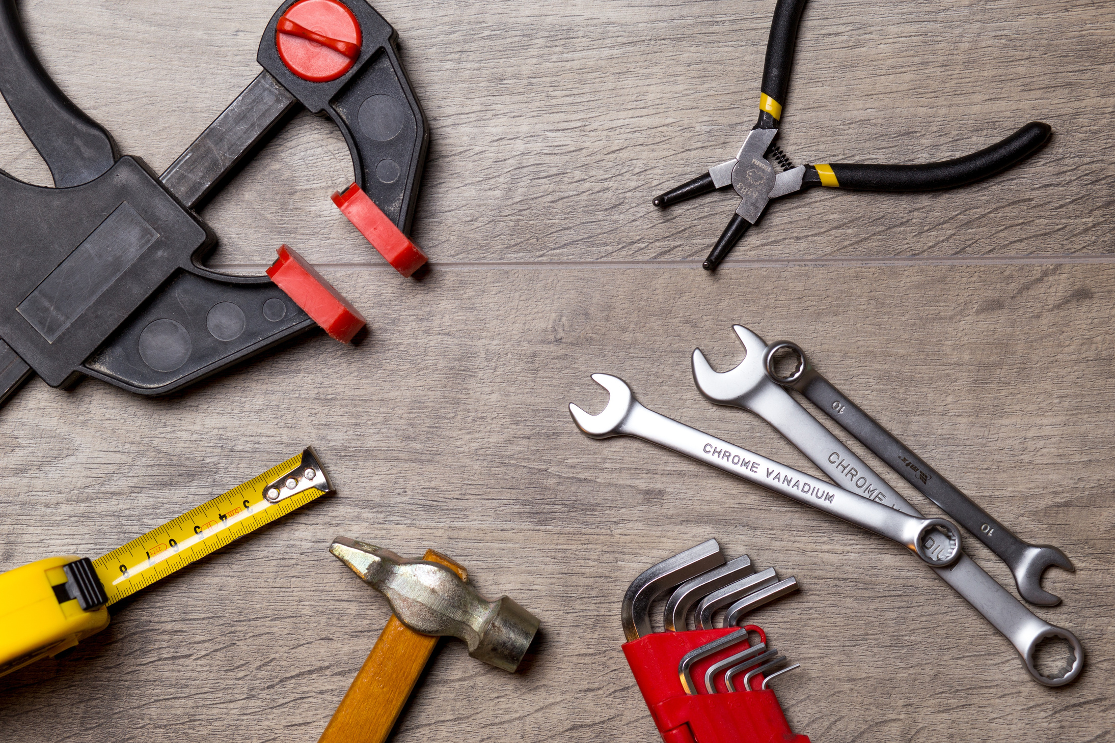 Top View of Repair Tools on Wooden Background